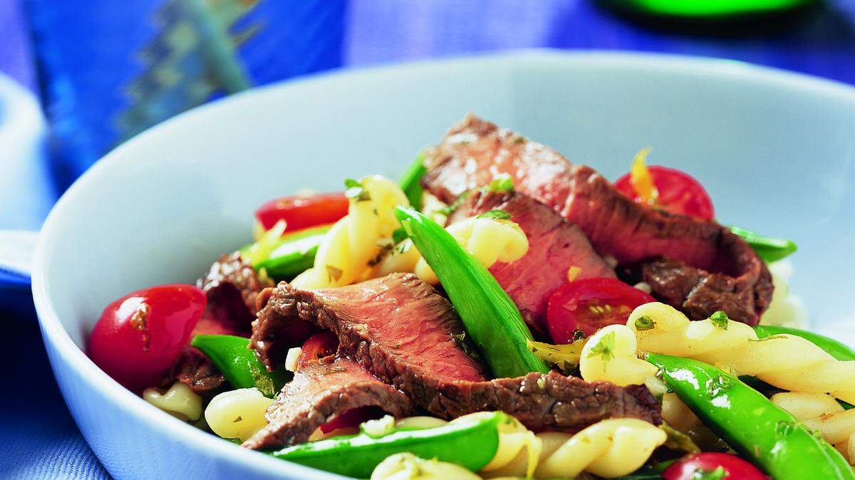 Lean beef such as top sirloin is good for those trying to control their cholesterol; add it to a sugar snap pea and pasta salad to make a meal in a bowl.