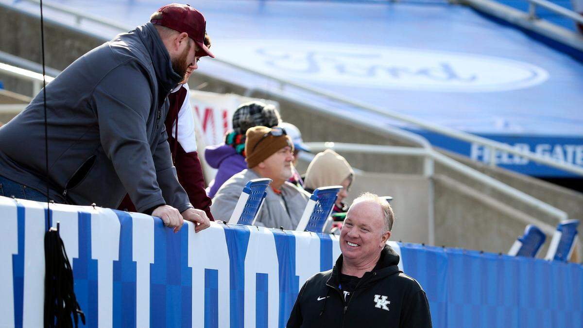 University of Kentucky football coach Mark Stoops visits with fans during Friday’s Class A state championship game at Kroger Field.