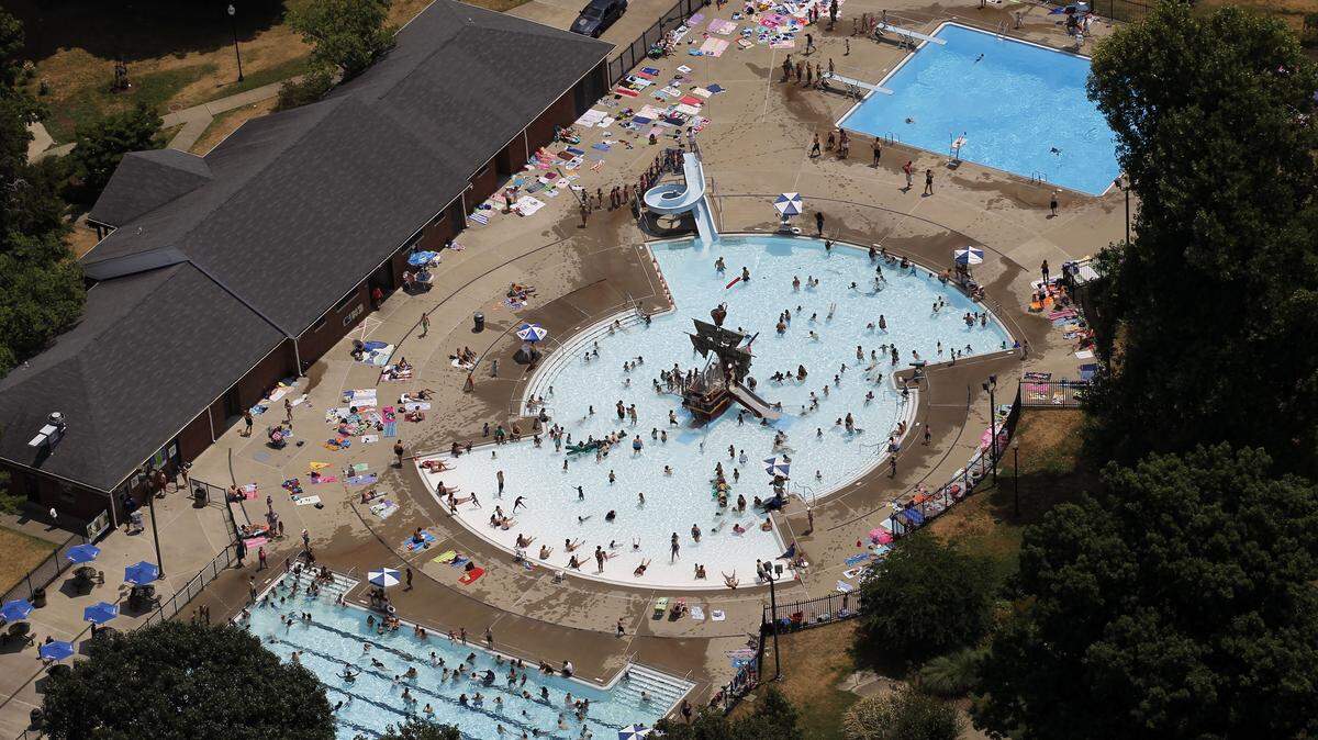 Aerial view people escaping the heat at the Woodland pool in Lexington, Ky., Friday, July 6, 2012. As a result of continuing high temperatures and limited rainfall, the Energy and Environment Cabinet Friday announced a water shortage watch for 27 counties in Kentucky, including Fayette and surrounding counties according to a news release. Photo by Charles Bertram | Staff