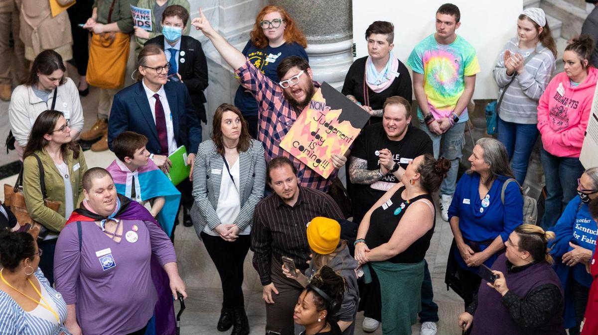 Protesters gather outside the House of Representative chambers while comments are heard on HB 470 at the Capitol in Frankfort, Ky., Thursday, March 2, 2022.