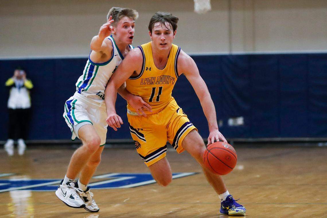 Lyon County’s Travis Perry (11) dribbles around North Laurel’s Kole Jervis during the teams’ game at Lexington Catholic on Jan. 7. Perry and the Lyons are two wins away from making a second consecutive trip to the Sweet 16.