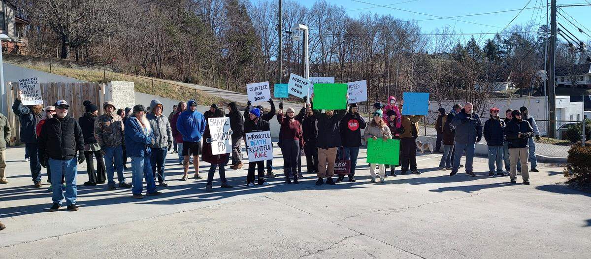 Protesters held signs outside the London Police Department in Laurel County, Ky., Saturday, Jan. 4, 2025, to call attention to the death of Douglas Harless. Harless died after being shot at his home by police who apparently had intended to go to a different address nearby to execute a search warrant.