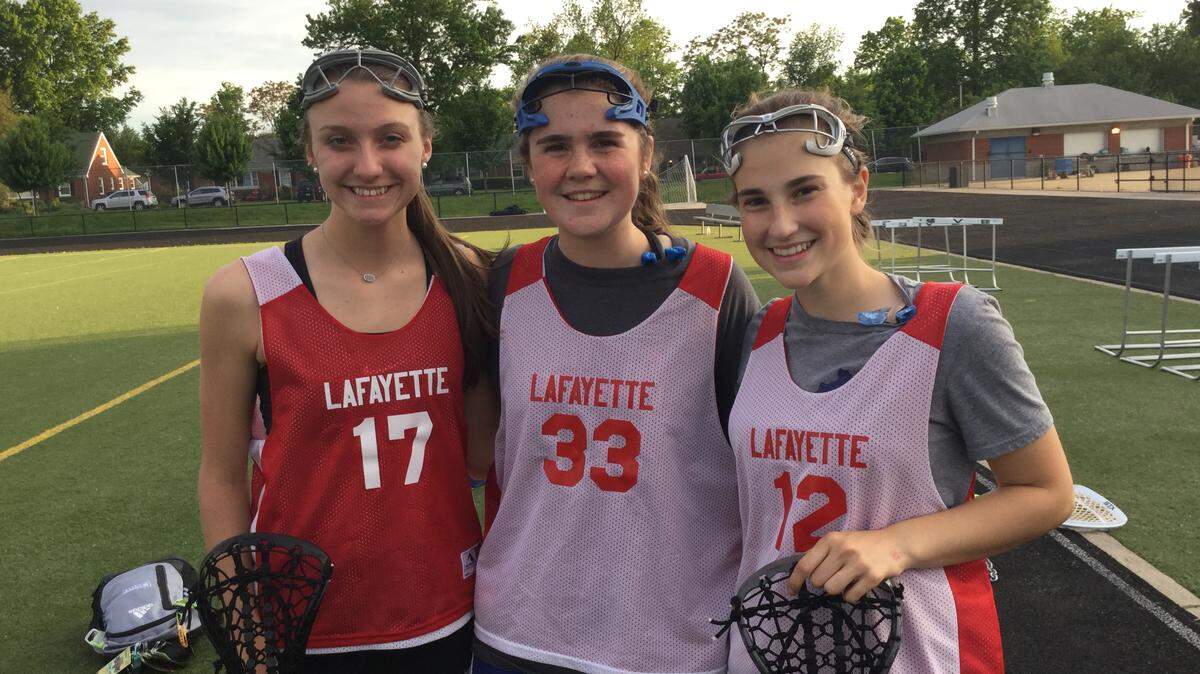 From left: Hannah Hodge, Isa Stumpf and Julia Howell, all of whom are sophomores on the Lafayette High School club lacrosse team, which will play in the state semifinals on Wednesday.