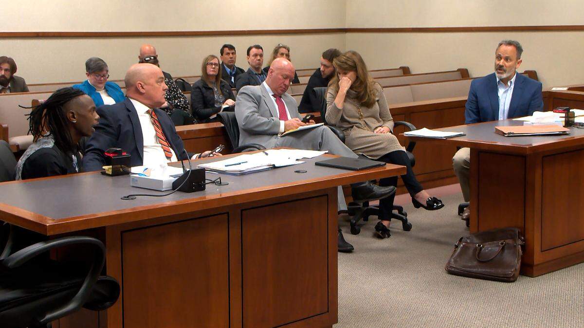 18-year-old Jonah Bevin, left, speaks to his adoptive father, former Kentucky Gov. Matt Bevin. Jonah obtained an emergency protective order against his parents, Matt and Glenna Bevin.