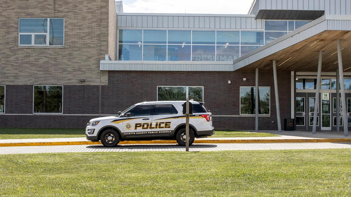 A Fayette County Public Schools police vehicle is parked in front of Frederick Douglass High School in Lexington, Ky., on Thursday, Sept. 22, 2022.