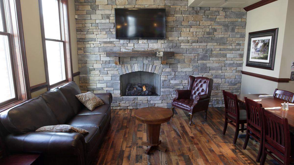 The fireplace and lounge area on the second floor of the new Jefferson Davis Inn (JDI) in the 500 block of South Broadway in Lexington, Ky., Monday, February 25, 2013. The well-known Jefferson Davis Inn is being revived along South Broadway. The grille and tavern has three floors. The JDI will have an official grand opening later in the week. Photo by Charles Bertram | Staff





