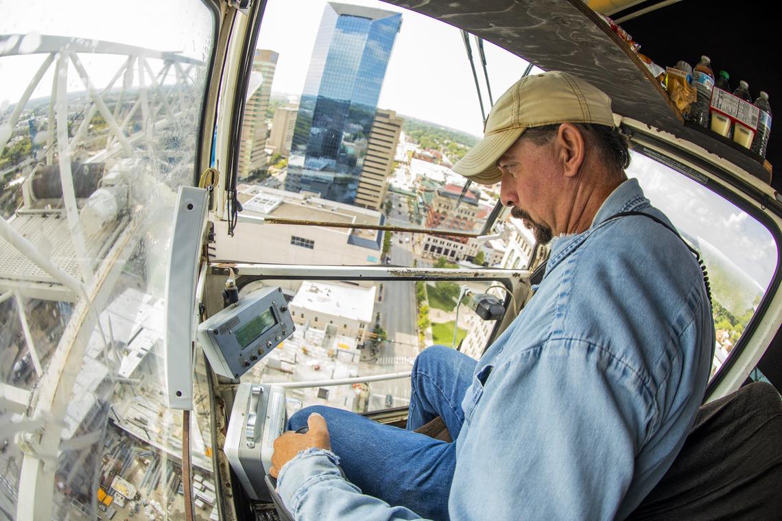 Ed Dangler, currently of Lancaster, worked to operate a tower crane Friday above City Center in downtown Lexington. Dangler has been a tower crane operator since 1993 and has worked in downtown Lexington for two years.