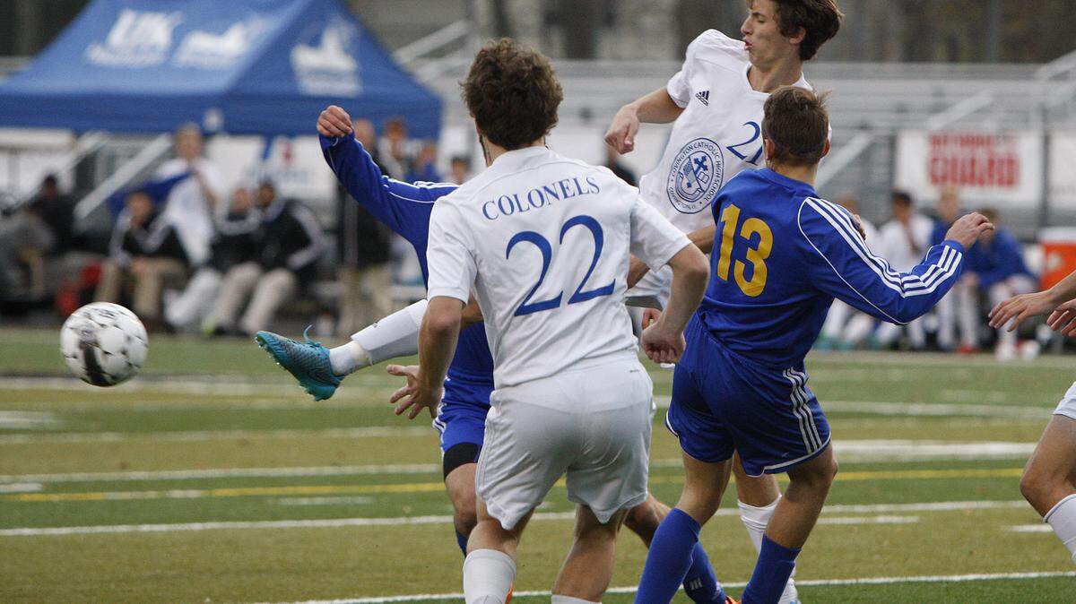 Covington Catholic's Nick Jacobs cleared a corner kick against Henry Clay during the boys' state championship at Paul Dunbar. Henry Clay was shut out for just the second time this season.    