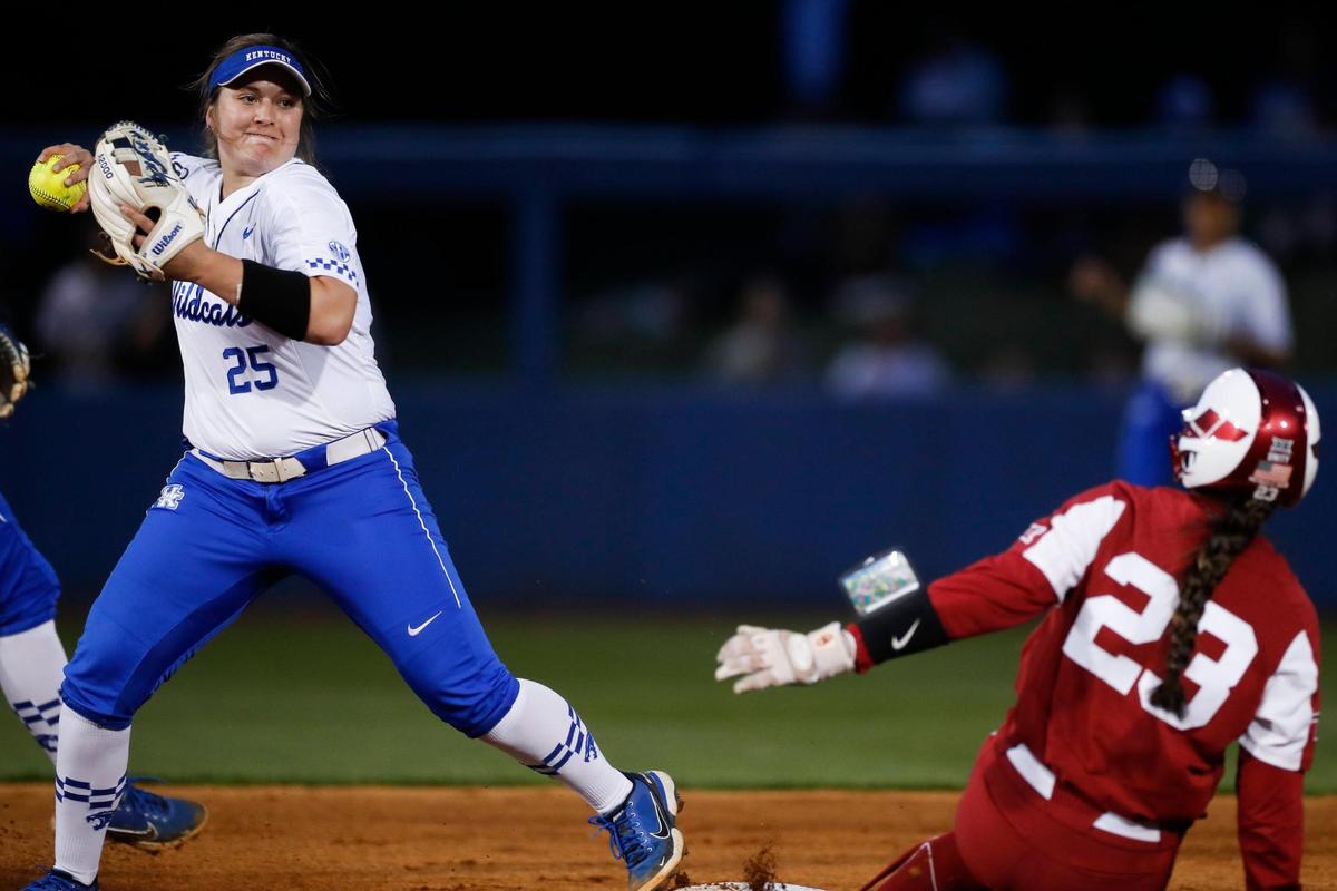 Kentucky’s Emmy Blane (25) tries to turn a double play against Oklahoma at John Cropp Stadium on Tuesday night. The No. 1 Sooners beat the No. 8 Wildcats in front of UK’s first-ever regular season sellout crowd.