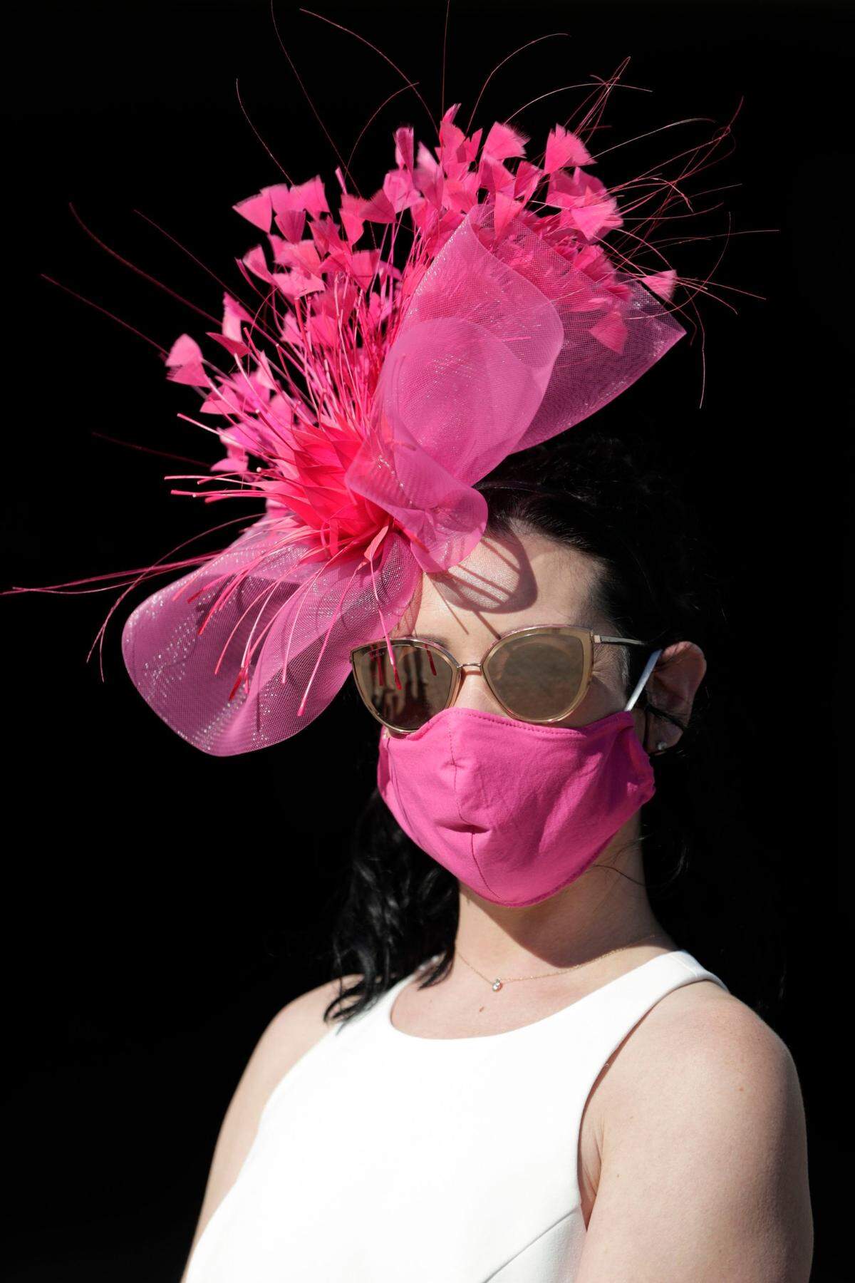 Aleah Lerma purchased her pink fascinator and mask from Hat Girls in Louisville to wear to the Kentucky Derby. She paired them with a white dress from Dillard’s and Chanel sunglasses.