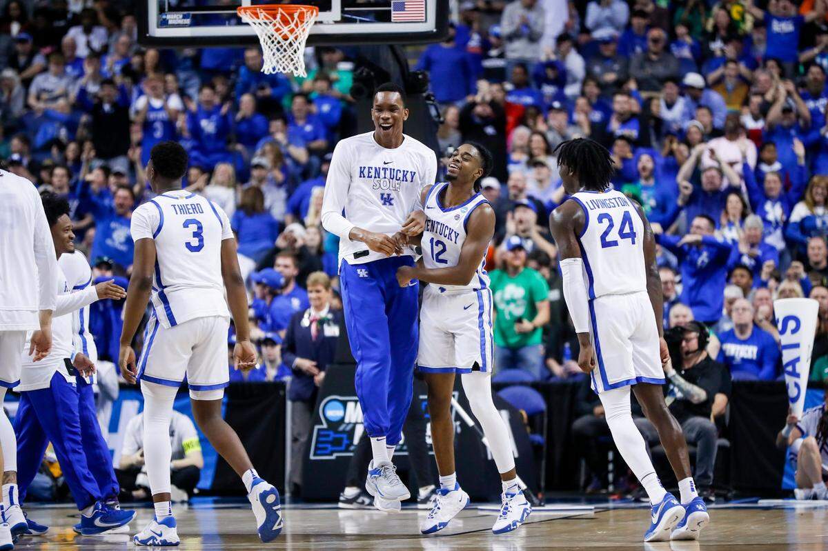 Kentucky guard Antonio Reeves (12) celebrates hitting a three-pointer against Providence during an NCAA Tournament first-round game at Greensboro Coliseum in Greensboro, N.C., on Friday.