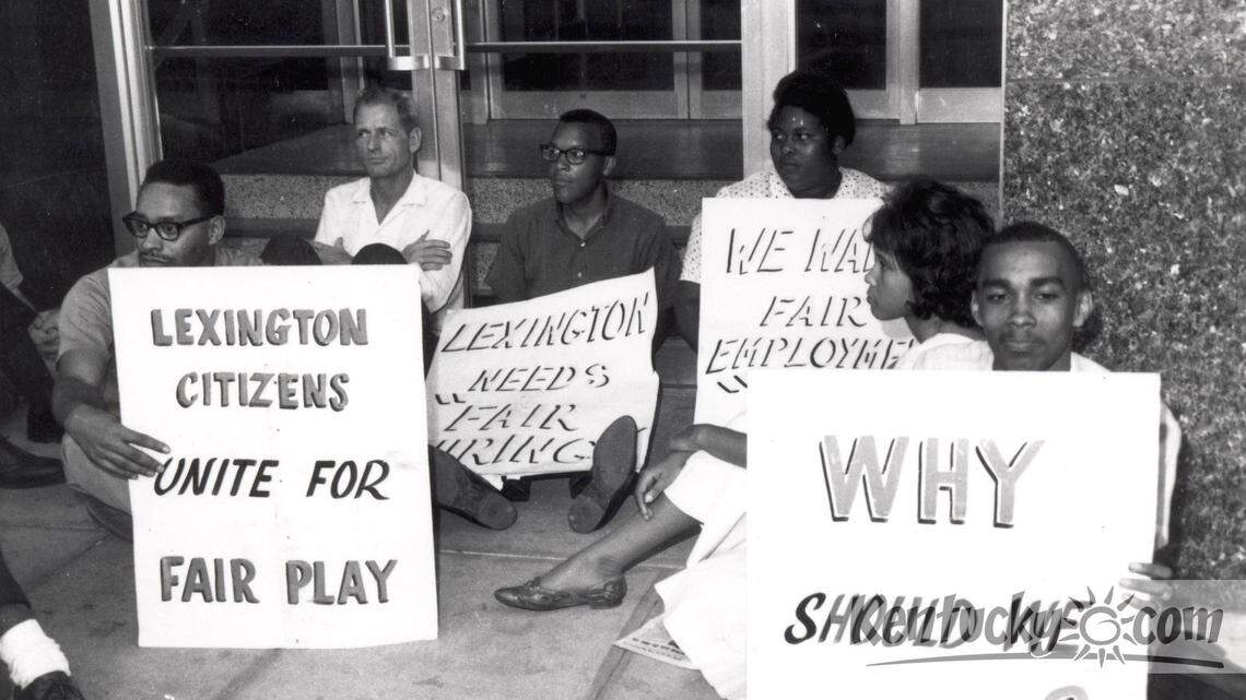 In the early 1960s, civil rights demonstrators sat in front of the old city hall on what was then Walnut Street in downtown Lexington, Ky., to demand employment opportunities for African Americans. Photo Courtesy Calvert McCann