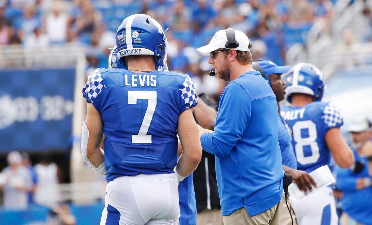 UK offensive coordinator Liam Coen instructs quarterback Will Levis during a game last season. Coen injected new life into Kentucky’s offense in 2021, when the Cats finished 10-3.
