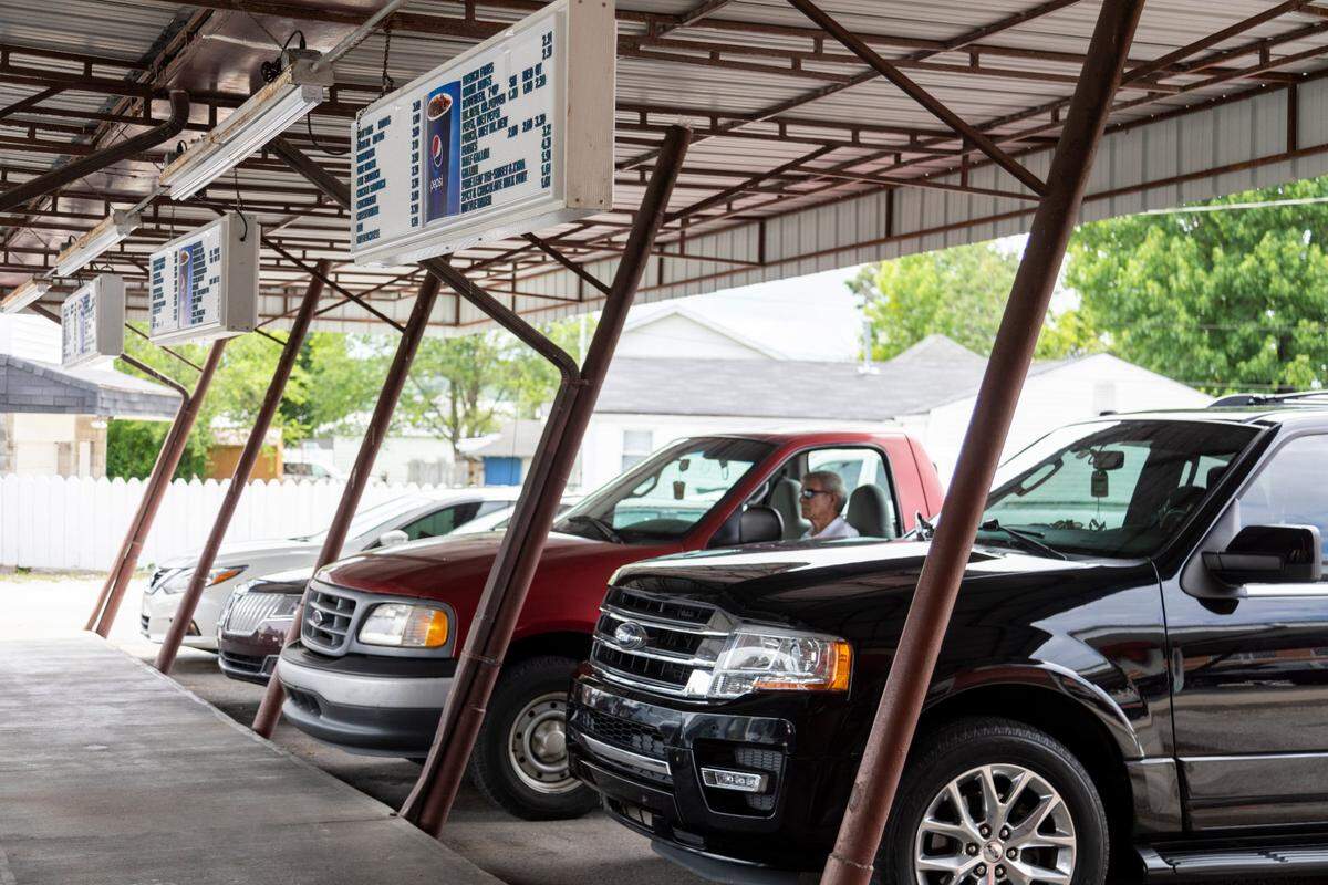 Cars under the carhop at the Rootbeer Stand in Corbin, Ky., Thursday, July 1, 2021. “It’s not hamburgers and hotdogs, its the community,” said manager Robert Champlin. Champlin is also the son of owner Willie Champlin. “The community owns the rootbeer stand, that’s why its been successful for so many years,” Robert Champlin said.