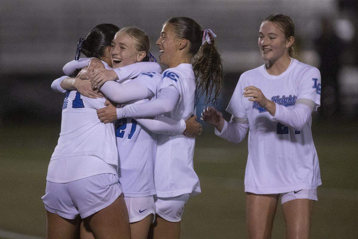 Lexington Catholics Lily Crist (17) is congratulated by her teammates after scoring a goal during a game in Lexington, Ky., on Wednesday, Oct. 29, 2025.