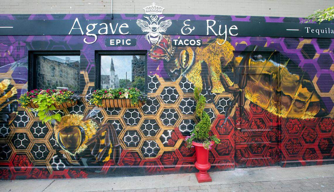 Artist Giovanni Santiago painted this mural on the outside at Agave & Rye’s new downtown Lexington location featuring bees.