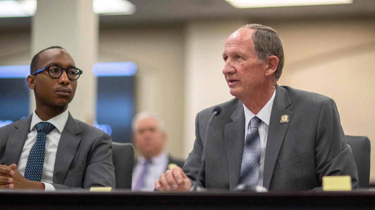 Kentucky Rep. Richard Heath, right, speaks while Darian Harris, an associate at Advantage Capital, looks on during a House Agriculture Committee hearing on House Bill 308 in the Capitol Annex in Frankfort, Ky., on Wednesday, Jan. 19, 2022. The bill, which would establish a new tax credits program, was sponsored by Heath and passed the committee.