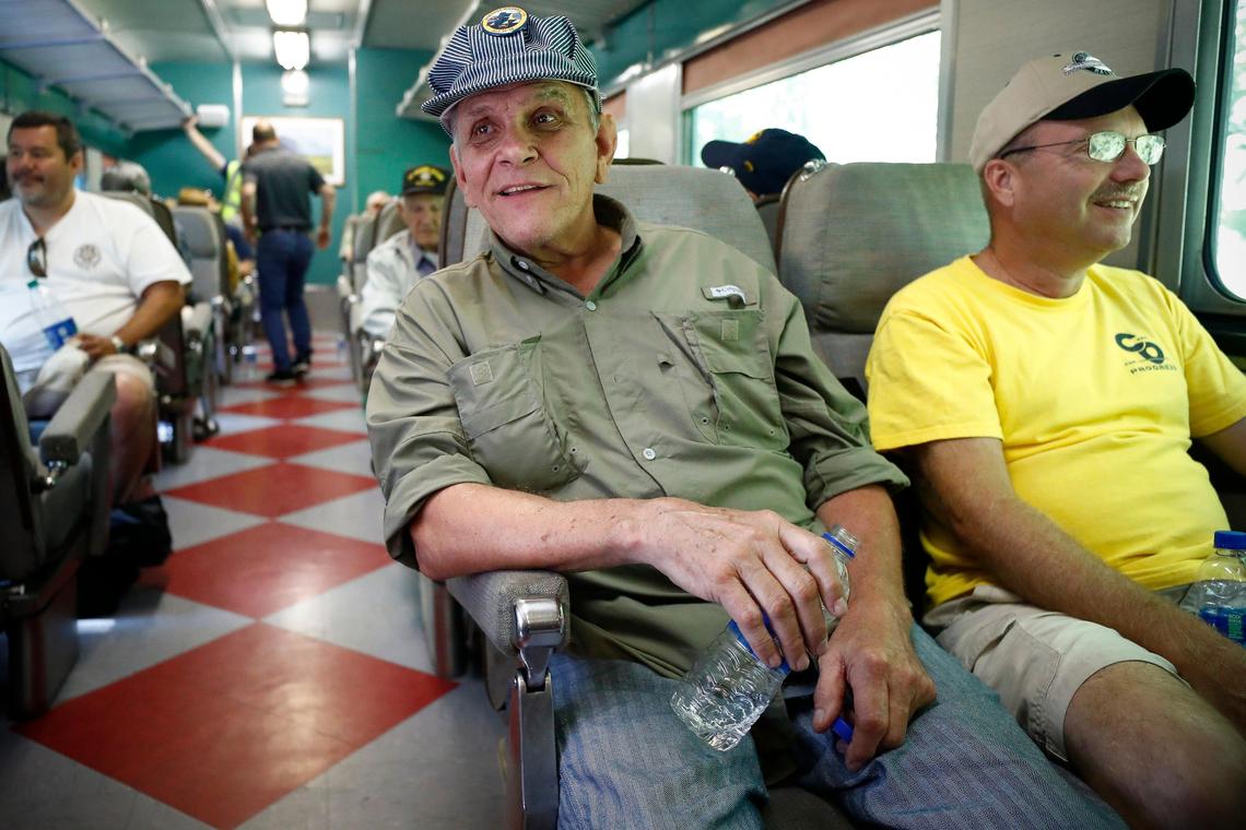 Dyke Parker, of Johnson City, Tenn., left, and Hobie Hyder, also of Johnson City, ride in a passenger car during the Friday’s excursion.
