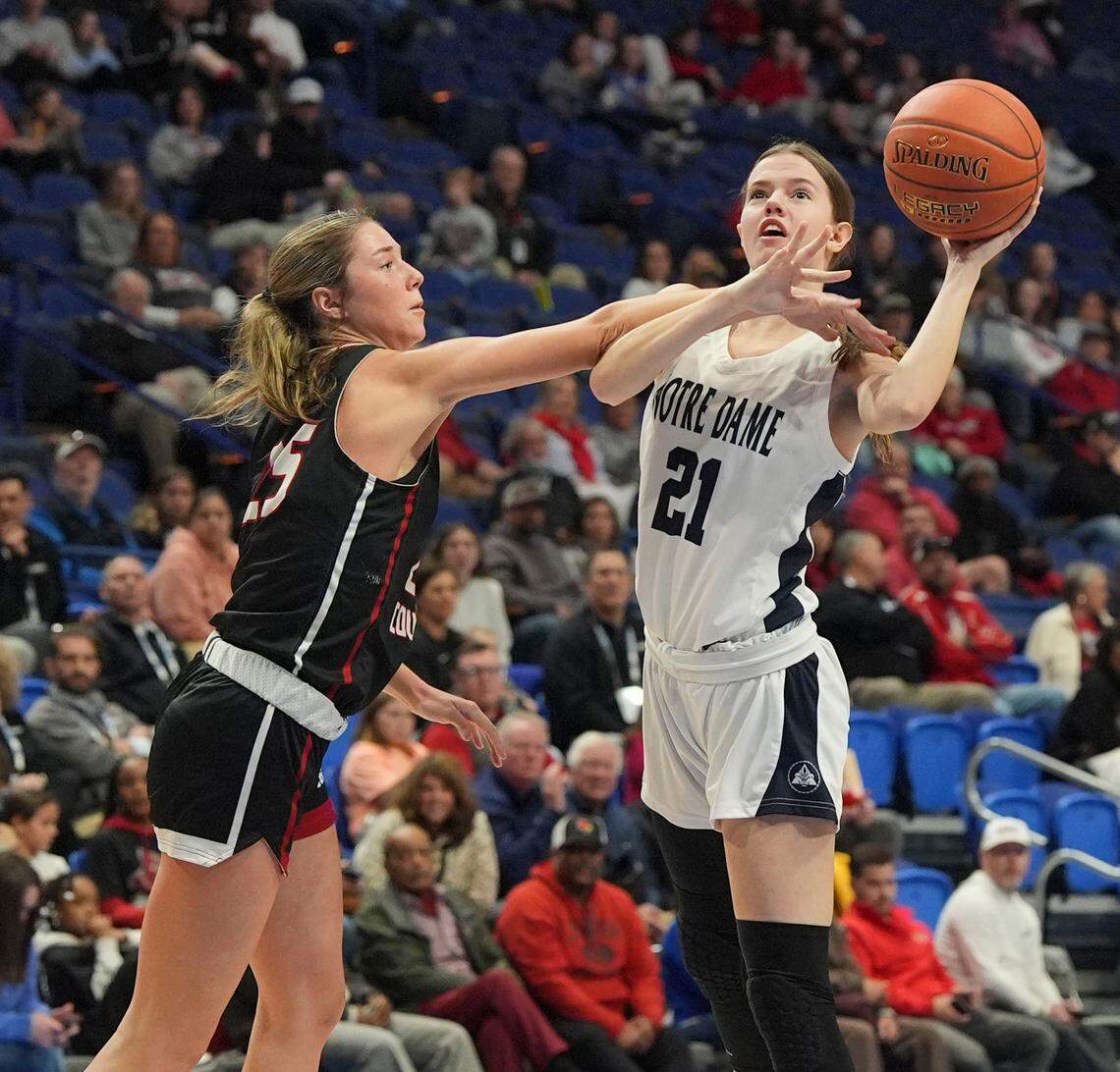 Taylor County’s Kennedy Deener defends Notre Dame’s Addie Lawrie during the Clark’s Pump-N-Shop Girls’ Basketball Sweet 16 quarterfinals at Rupp Arena on Friday.