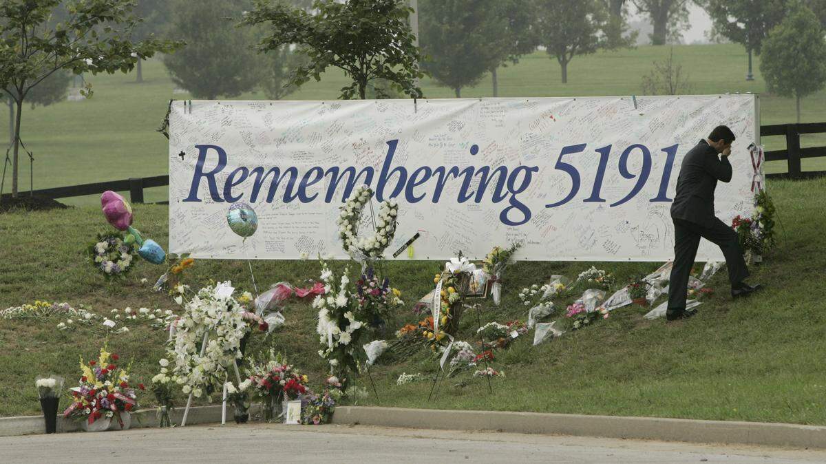 Michael Gobb, then director of Blue Grass Airport, wiped away tears after visiting a memorial for people to honor those who died in the Comair Flight 5191 earlier this week in Lexington in August 2006, shortly after it was installed at the airport.