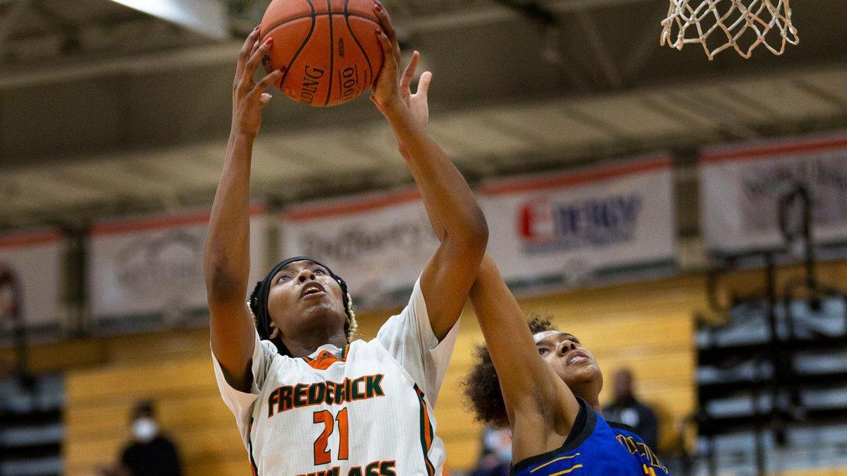 Frederick Douglass’ Ayanna-Sarai Darrington grabbed the rebound away from Henry Clay’s Jamya Smith in the fourth quarter of the Henry Clay at Frederick Douglass girl’s high school basketball game in Lexington, Ky. on Jan. 13, 2022. Frederick Douglass beat Henry Clay 72-62.