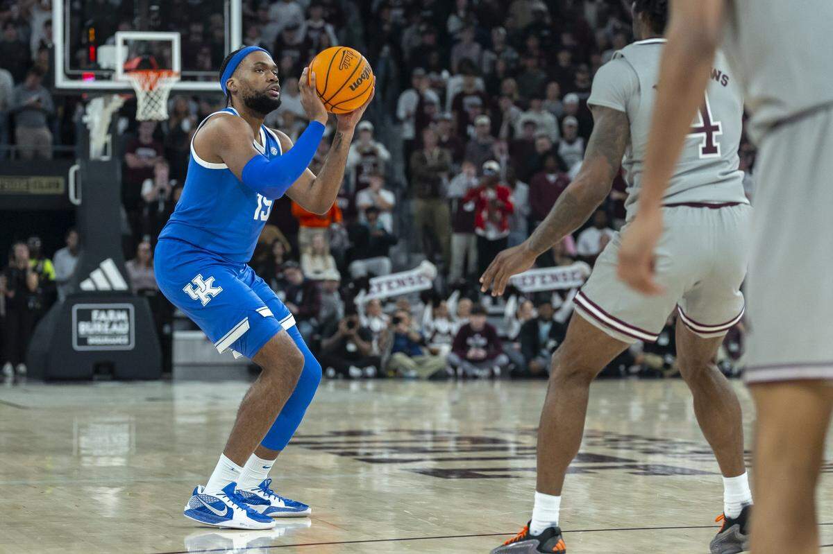 Kentucky basketball forward Ansley Almonor, left, shoots a 3-pointer during a game against Mississippi State at Humphrey Coliseum in Starkville on Jan. 11. Almonor has made more than 200 3-pointers in his college basketball career.
