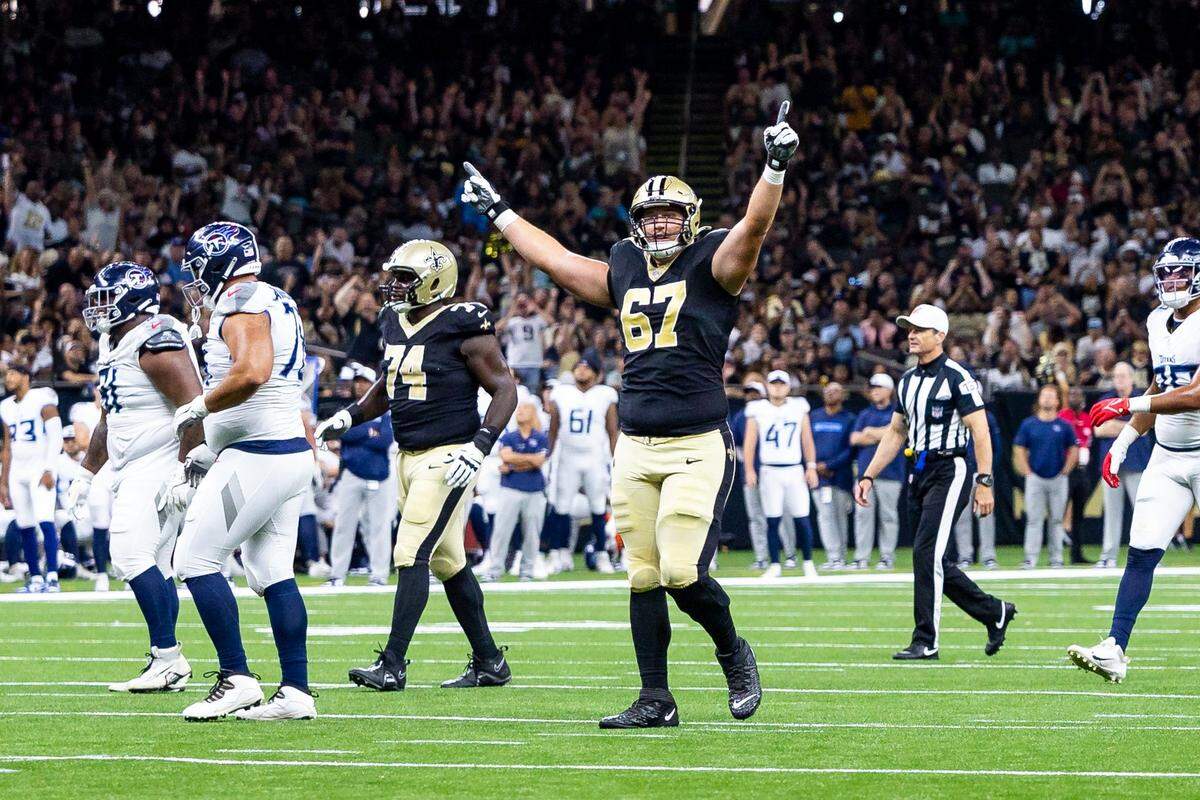 Aug 25, 2024; New Orleans, Louisiana, USA;  New Orleans Saints offensive tackle Landon Young (67) reacts to a touchdown pass against the Tennessee Titans during the first half at Caesars Superdome. Mandatory Credit: Stephen Lew-USA TODAY Sports
