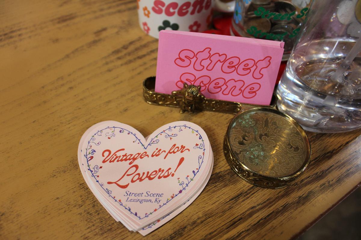 Business cards and stickers sit on the checkout counter at Street Scene, a vintage store in Lexington, Kentucky.