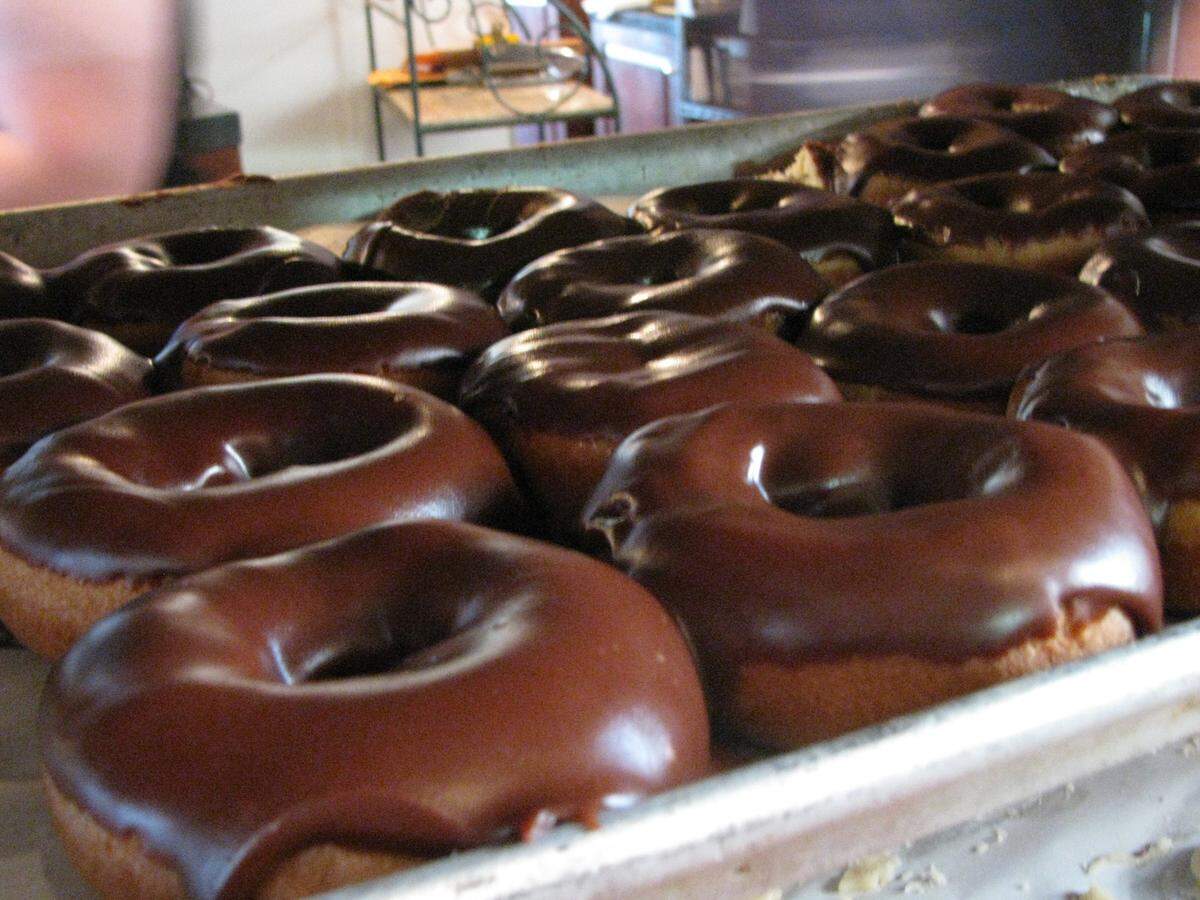 Doughnuts dripping with Magee’s homemade chocolate icing.