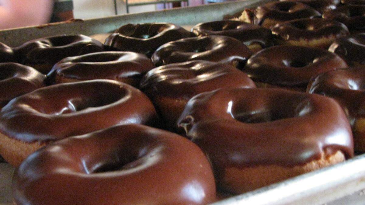 Doughnuts dripping with Magee’s homemade chocolate icing waited on a rack for customers. Magee’s made everything, from the doughnut to the icing, from scratch.