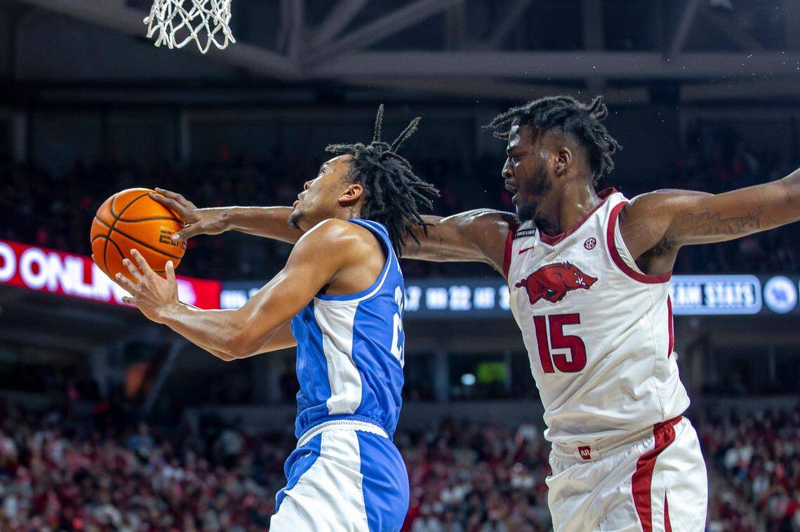 Arkansas forward Makhi Mitchell (15) blocks a shoot by Kentucky guard D.J. Wagner during Saturday’s game at Bud Walton Arena in Fayetteville, Ark.