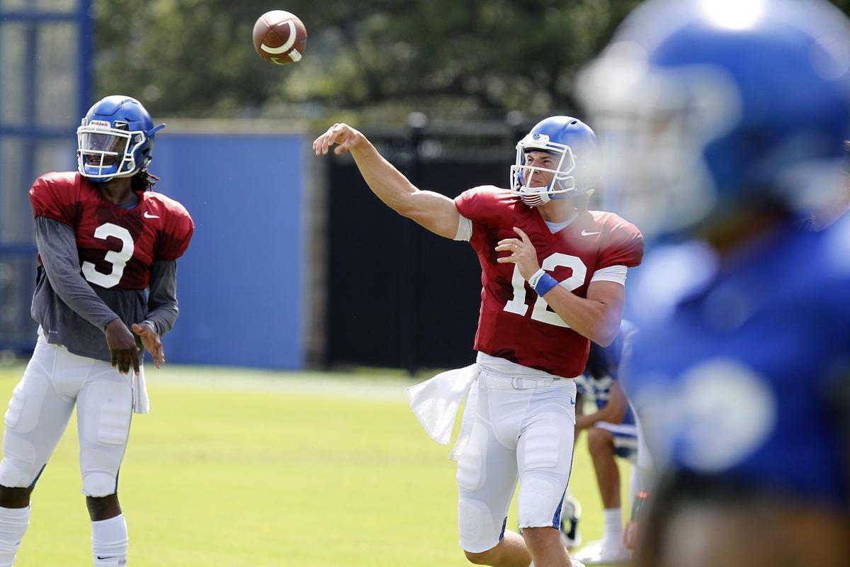 Quarterbacks Terry Wilson (3) and Gunnar Hoak (12) threw together during a Kentucky practice. UK opens its season against Central Michigan on Sept. 1 at Kroger Field.