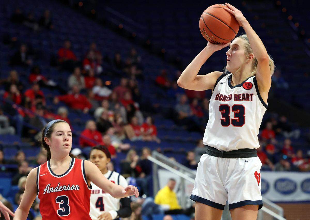Josie Gilvin (33) won two high school state championships at Sacred Heart Academy before playing three seasons at Western Kentucky University.