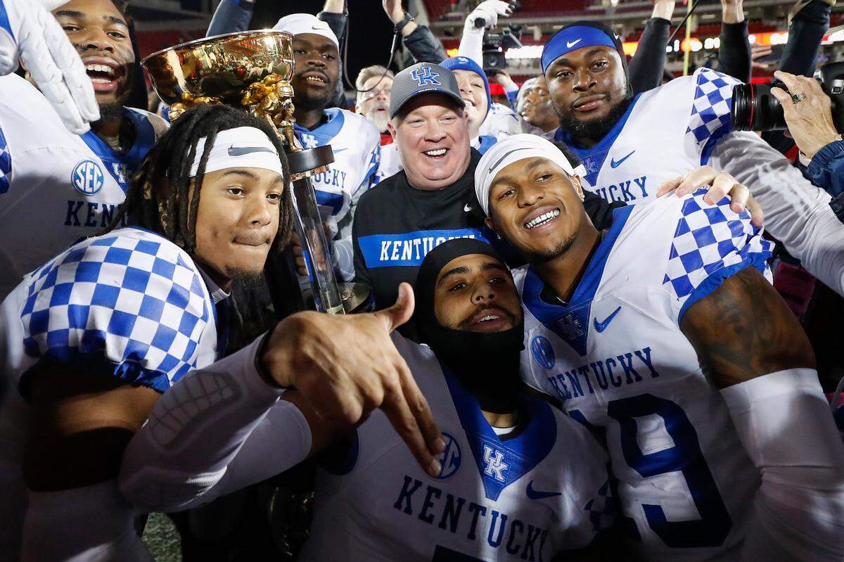 Coach Mark Stoops and his players celebrated after Kentucky beat Louisville for the Governor’s Cup in the regular-season finale. The positive vibes for the program extended through this week’s early signing period.