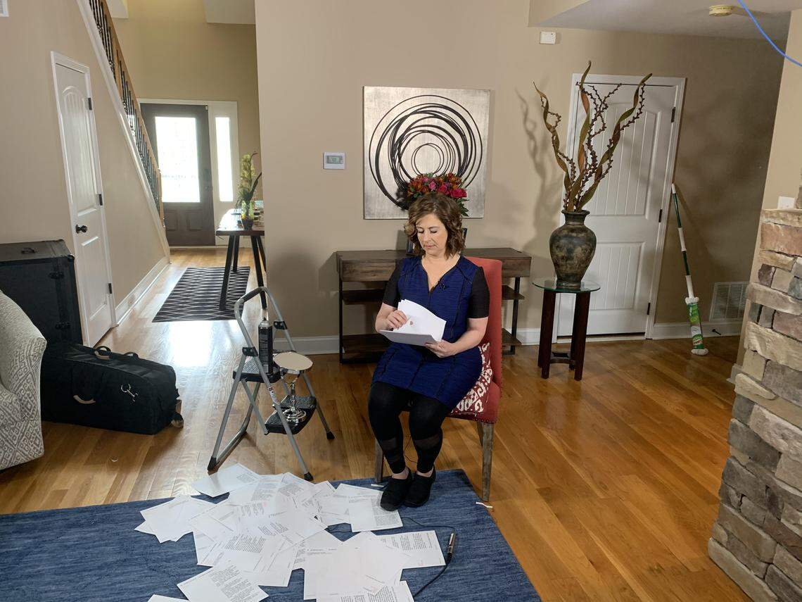Nancy Cox has turned her living room into a home studio where she anchors the evening news. She regularly changes the flowers and photos behind her. And viewers notice.
