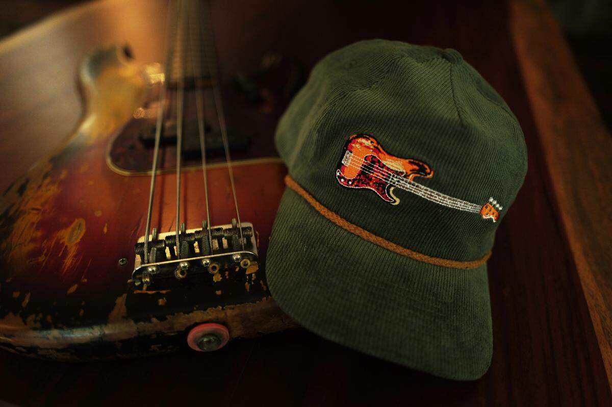 The J.T. Cure Bass Guitar Hat is for sale online at Newfrontierbrand.com for $30.