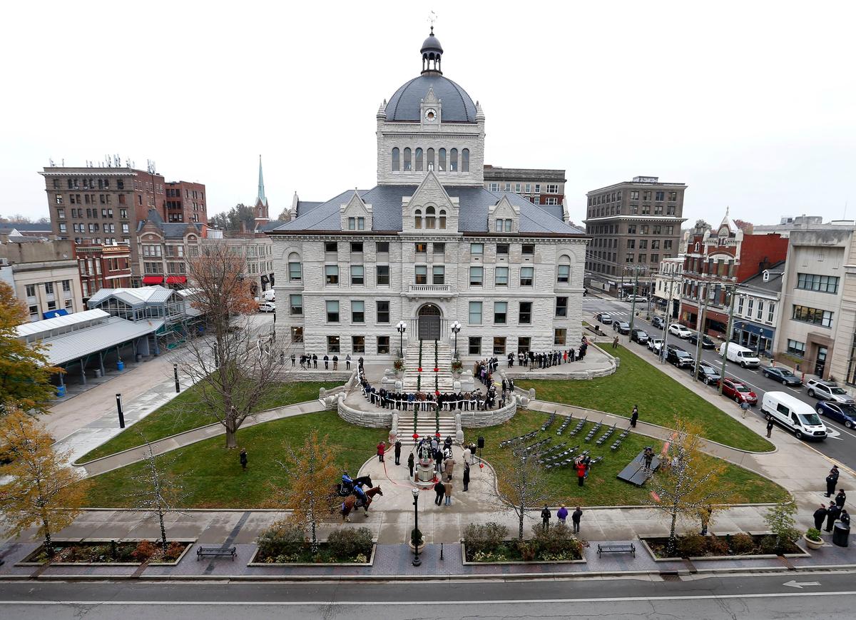 Mayor Jim Gray, former Kentucky Supreme Court Justice Mary Noble, members of the Urban County Council, and other officials and citizens cut a ribbon that completely encircled the building, to officially rededicate The Historic Courthouse at Courthouse Square on West Main Street in Lexington. The $32 million renovation and restoration of the the circa 1899 former Fayette County Courthouse took two years.