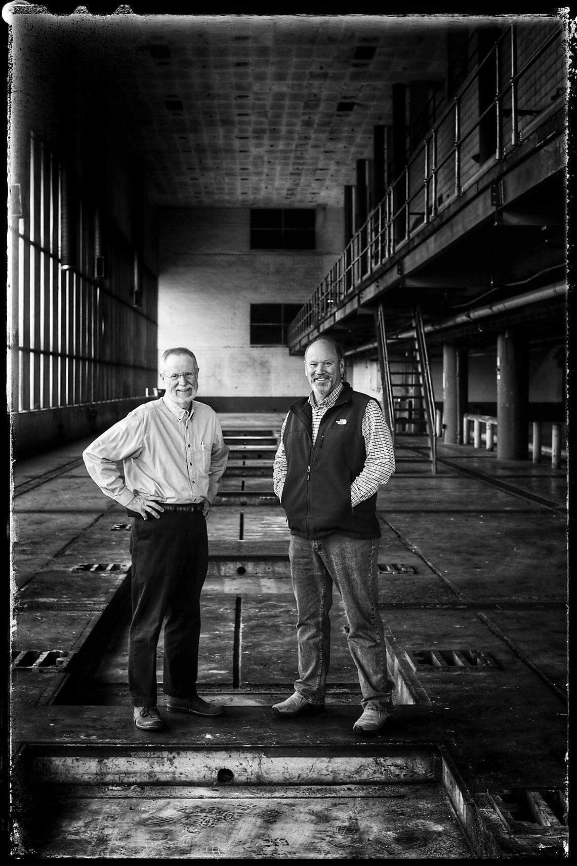Lexington Herald Leader Visuals Editor Ron Garrison and Chief Photographer Charles Bertram posed in the old press room at the Herald-Leader building in Lexington. The pair retired Thursday, Feb. 28, 2019, after a career that spanned a combined 85 years.