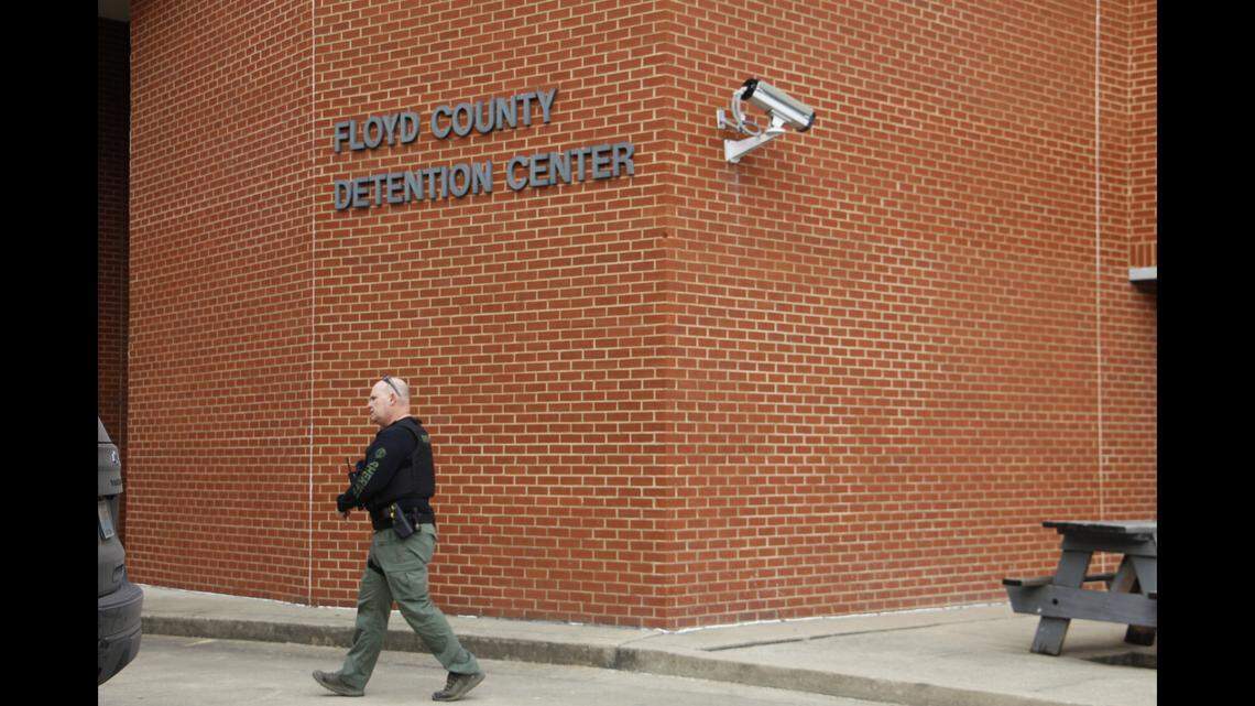 A Floyd County Sheriff’s Office employee walks past the county detention center Dec. 3, 2025. An inmate in jail custody died Saturday in what police say was an apparent suicide.