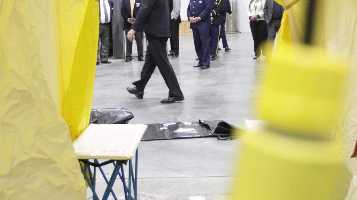 Officials took a tour of a decontamination tent at Bluegrass Station's new facility.  