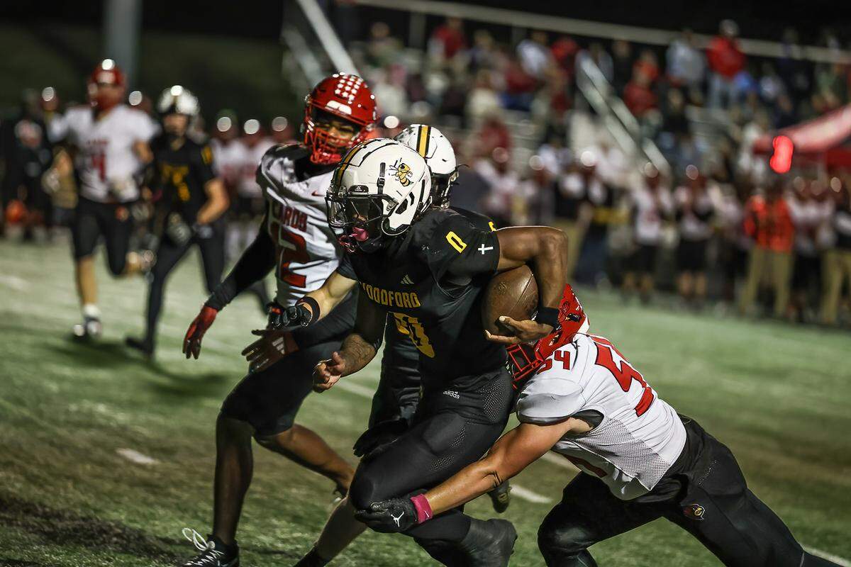 Woodford County’s Darrian Tomlin rushed for 188 yards and four touchdowns against Scott County in the Yellow Jackets’ 57-50 win at Community Stadium in Versailles on Friday.