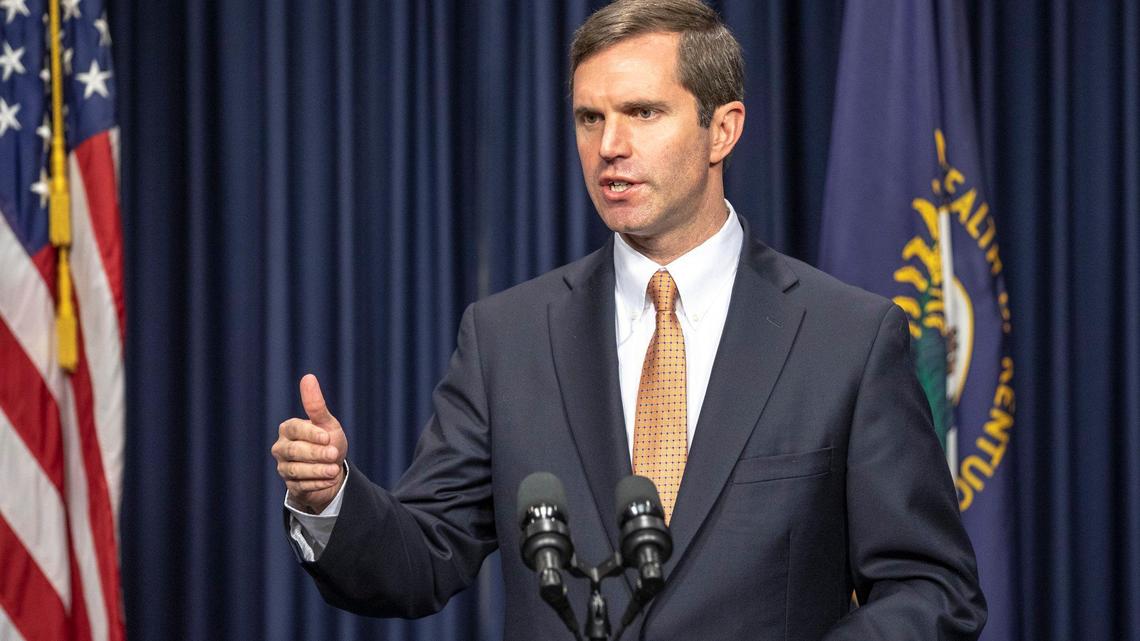 Kentucky Gov. Andy Beshear signs an executive order rescinding former Gov. Matt Bevin’s plan for Medicaid work requirements and premiums during a news conference at the Capitol in Frankfort, Ky., Monday, Dec. 16, 2019.