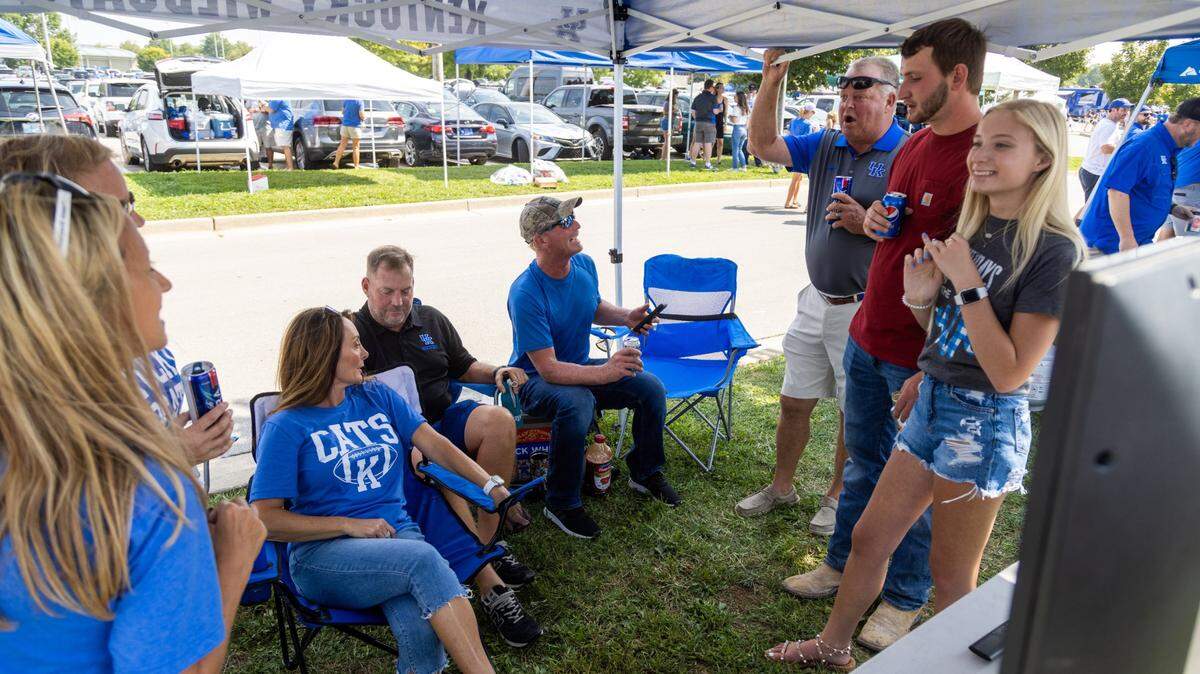Several friends from Garrard County gather at a tailgate in the Kroger Field parking lot prior to UK football’s season opener against Louisiana Monroe, Sept. 4. Kroger Field allowed tailgating to return for the season after a year off due to the COVID pandemic.