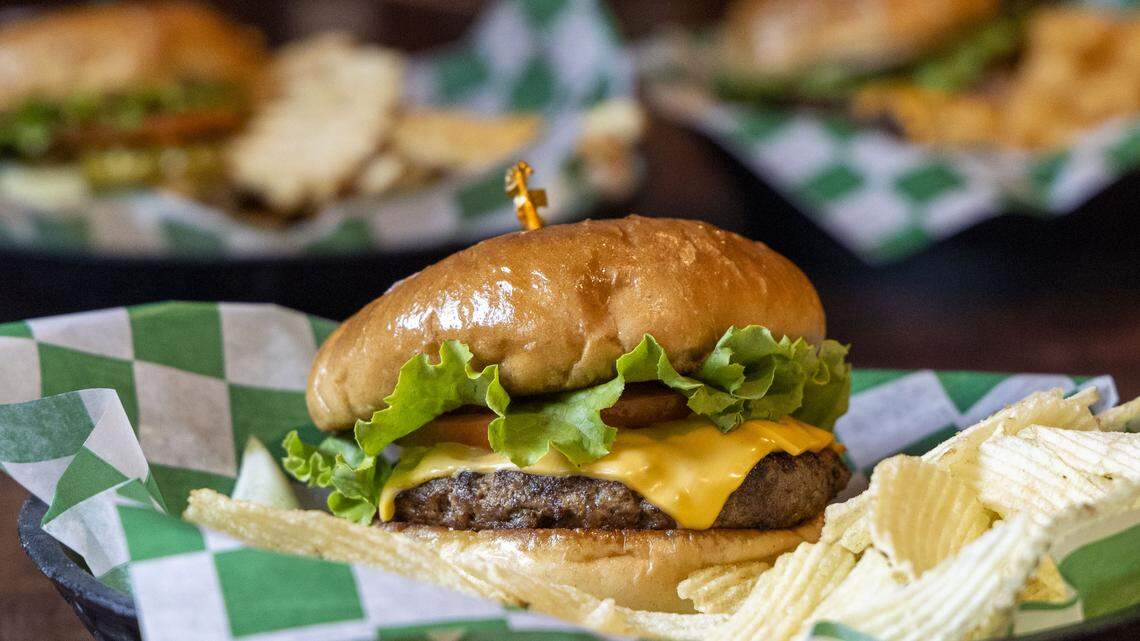 The O’Round burger at Shamrock Bar & Grille on Patchen Drive, Wednesday, Sept. 24, 2025, in Lexington, Ky. The seven-ounce burger ($12), which was created in 1981 at sister bar and restaurant Lynagh’s, is cooked to order, topped with choice of cheese, lettuce, tomato, onion and mayonnaise on a brioche bun. All O’Rounds come with a pickle spear and chips, but for an upcharge, you can sub chips for any side.