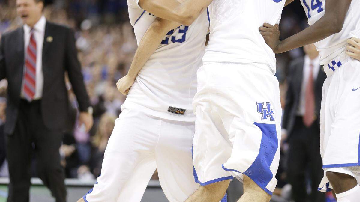 Kentucky's Anthony Davis (23), Eloy Vargas (30) and Michael Kidd-Gilchrist (14) celebrated after defeating Kansas in the NCAA championship game on April 2, 2012, in New Orleans.  
