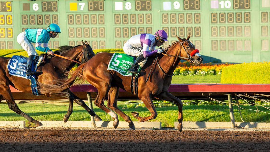 Slow Down Andy beats Messier to the finish line to win the Grade 2 Los Alamitos Futurity last December. After compiling 60 points on the 2022 Road to the Kentucky Derby, he was knocked out of the Run for the Roses by illness in April.