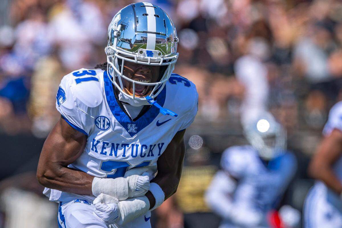 Kentucky Wildcats defensive back Maxwell Hairston celebrates after returning an interception for a touchdown against Vanderbilt at FirstBank Stadium in Nashville.