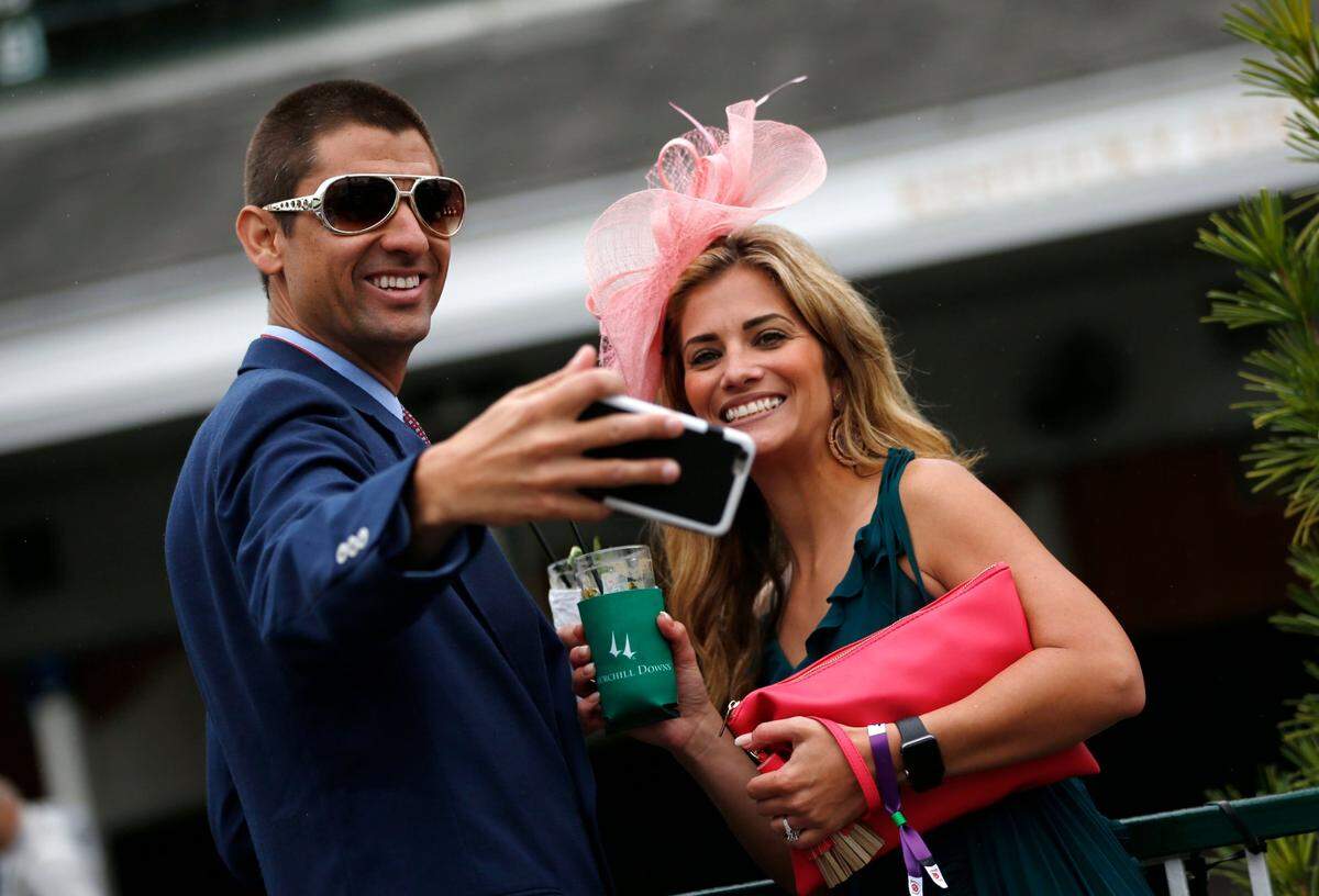 Fans took a selfie in the paddock area during the 2019 Kentucky Derby. Spectators will be required to wear masks this year, and their movements will be limited to specific locations.