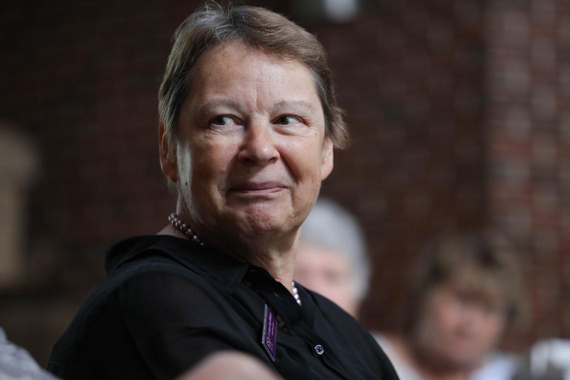 Dr. Susan Kay-Williams listens to a colleague speak during a question and answer session at the The Royal School of Needlework classes held at Sayre School recently.