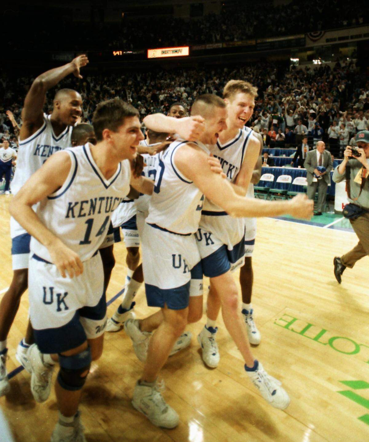 Kentucky reserve Todd Svoboda, center, was mobbed by teammates Jeff Brassow, left, and Jared Prickett after he hit a 3-point shot that put the finishing touches on UK’s 106-81 blitzing of Florida State in the 1993 NCAA Tournament round of eight in Charlotte, N.C.